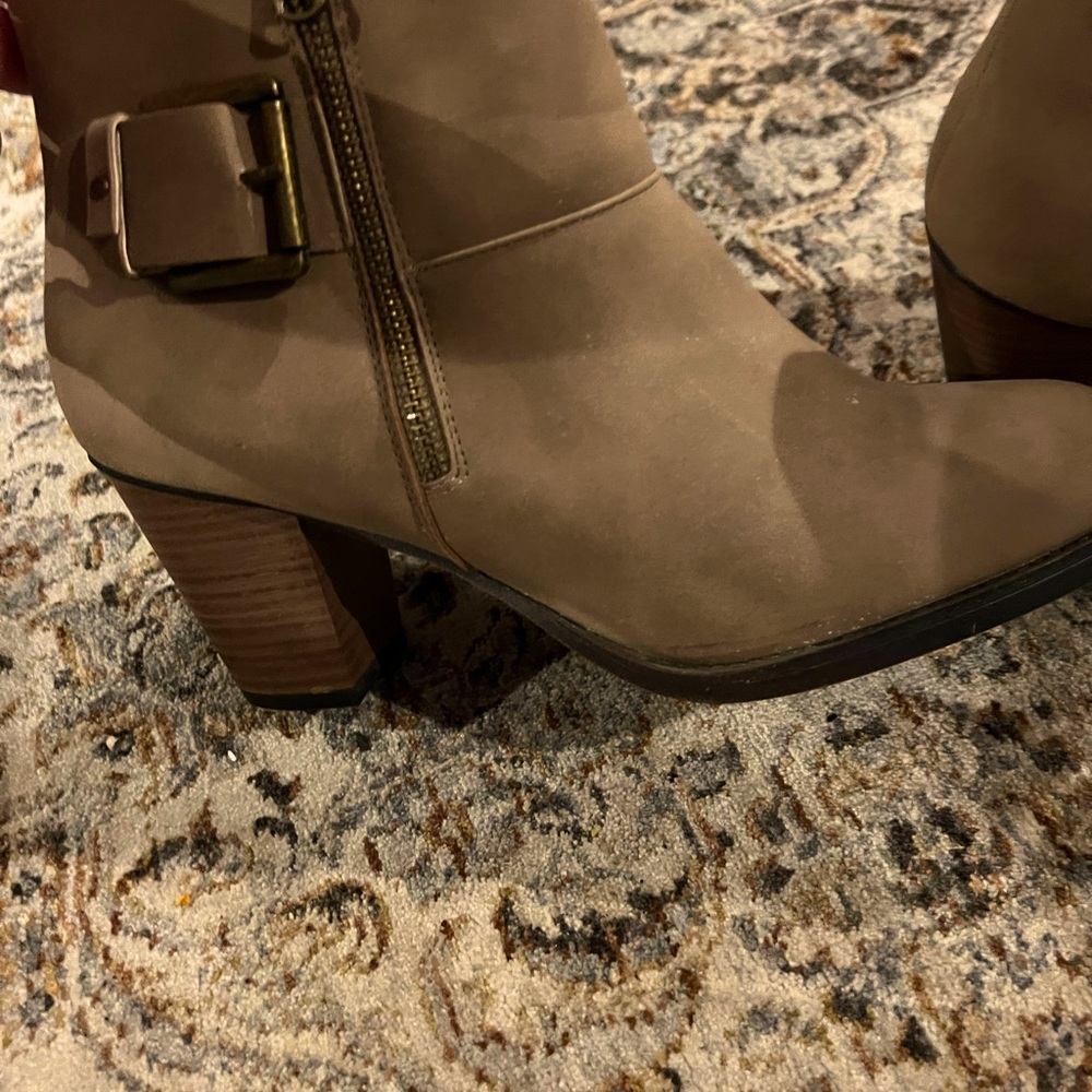 Light brown booties with a small heel. Very cute